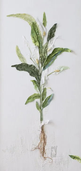 Crouching under the Peace Lily